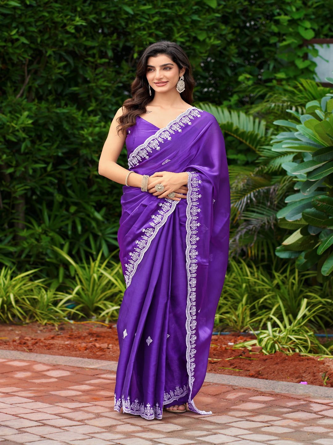 Golden Radiance: Highlighting the glowing tone of the beige shimmer chiffon saree.