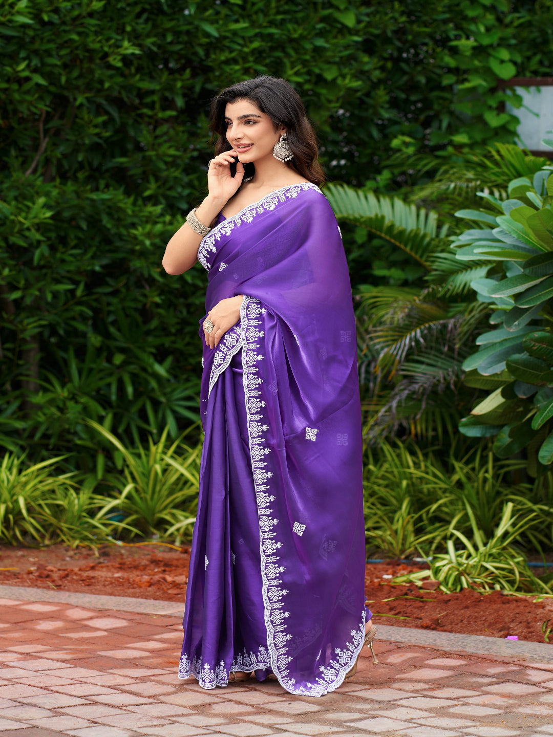 Golden Radiance: Highlighting the glowing tone of the beige shimmer chiffon saree.