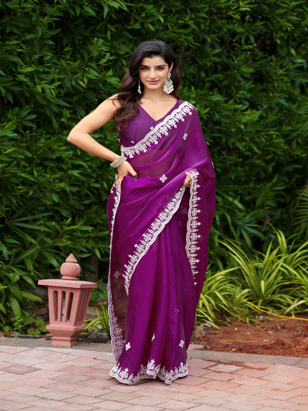 Golden Radiance: Highlighting the glowing tone of the beige shimmer chiffon saree.