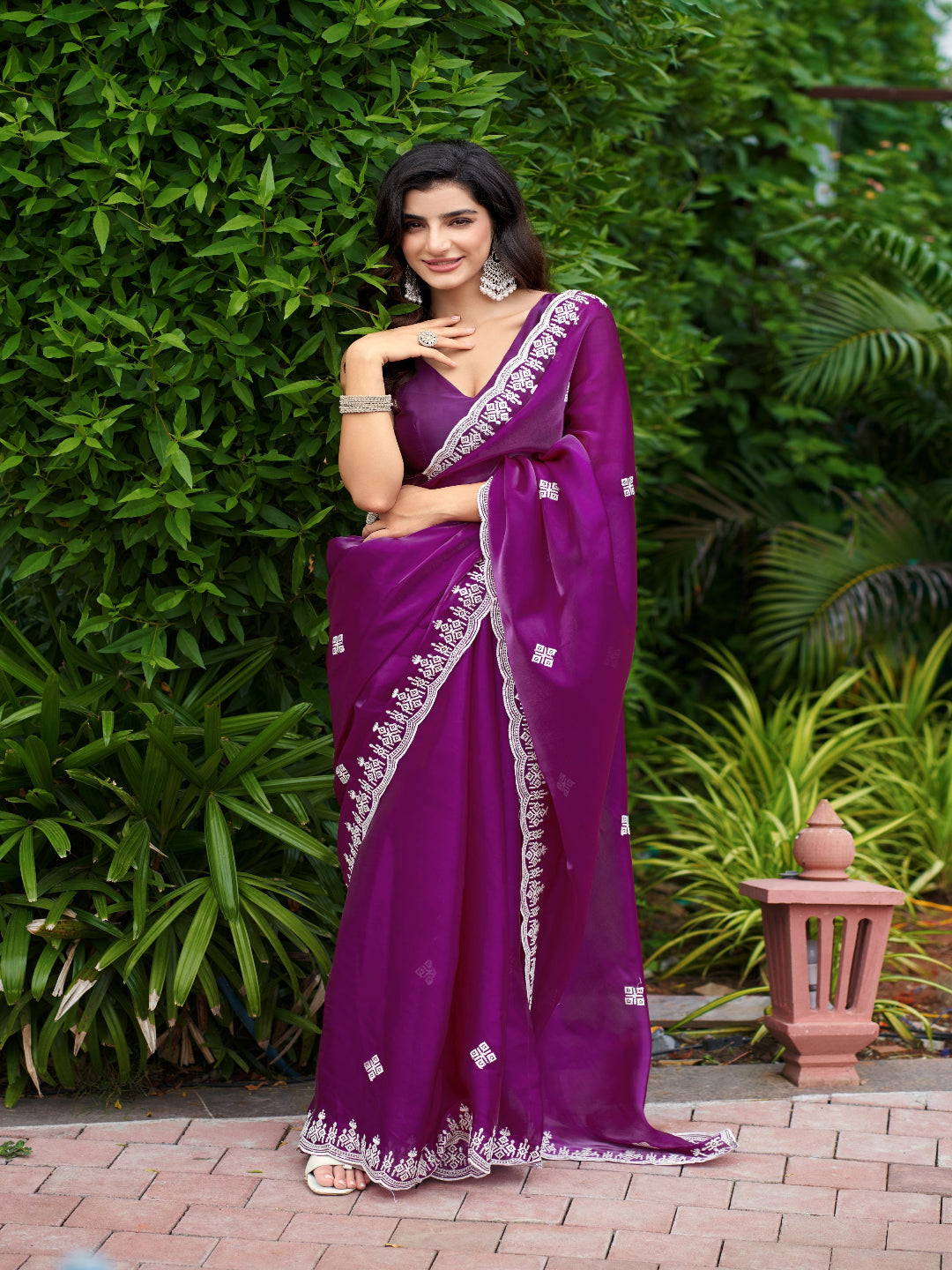 Golden Radiance: Highlighting the glowing tone of the beige shimmer chiffon saree.