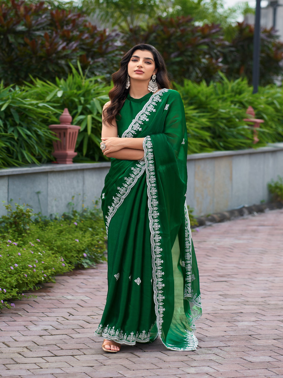 Golden Radiance: Highlighting the glowing tone of the beige shimmer chiffon saree.