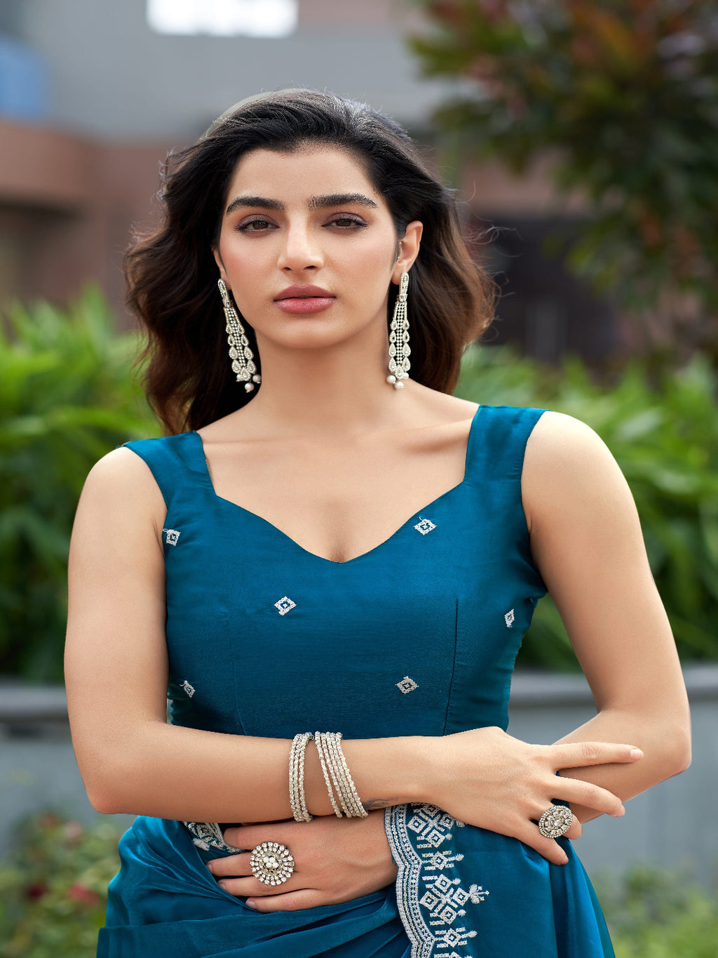 Golden Radiance: Highlighting the glowing tone of the beige shimmer chiffon saree.