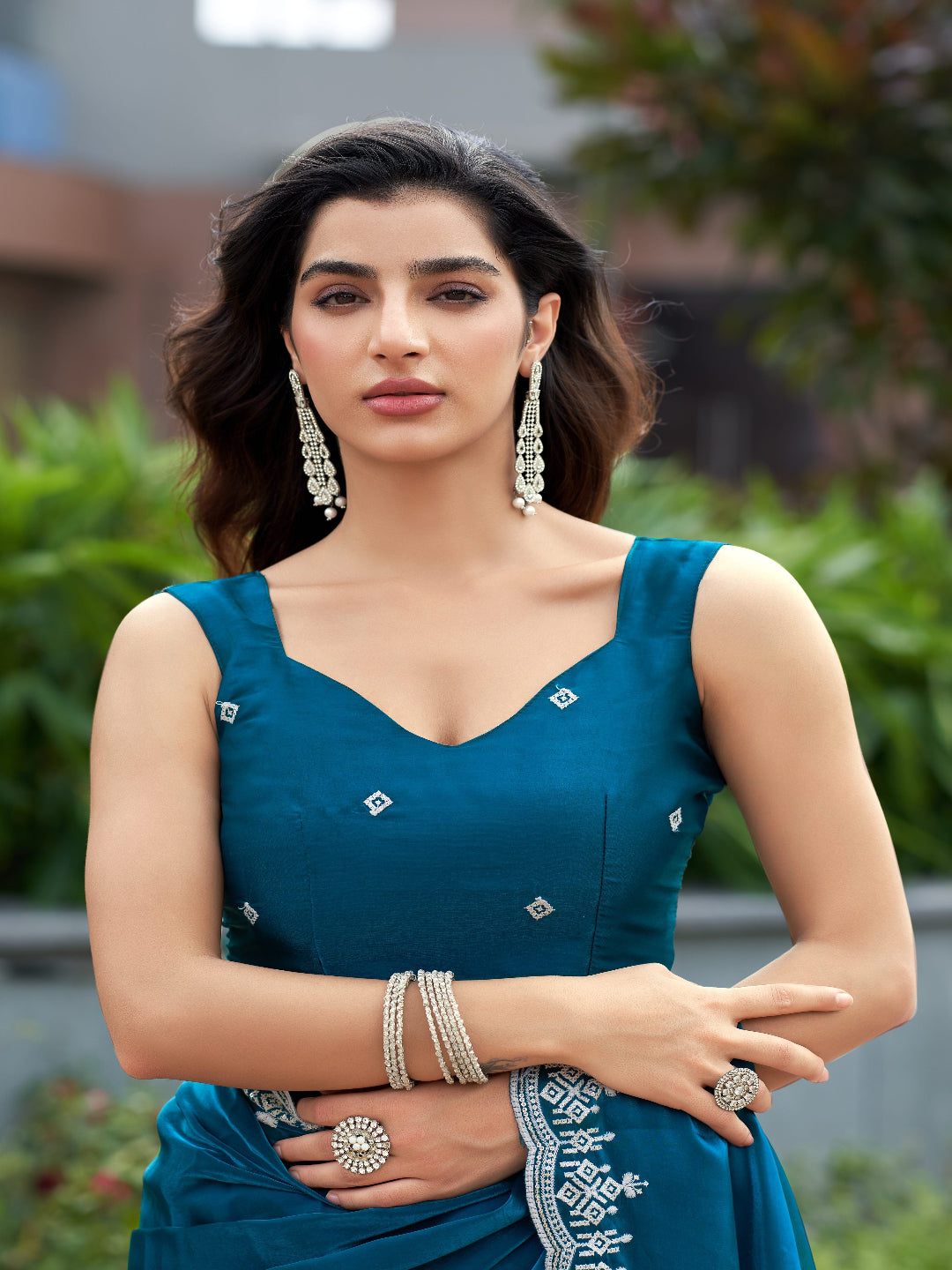 Golden Radiance: Highlighting the glowing tone of the beige shimmer chiffon saree.