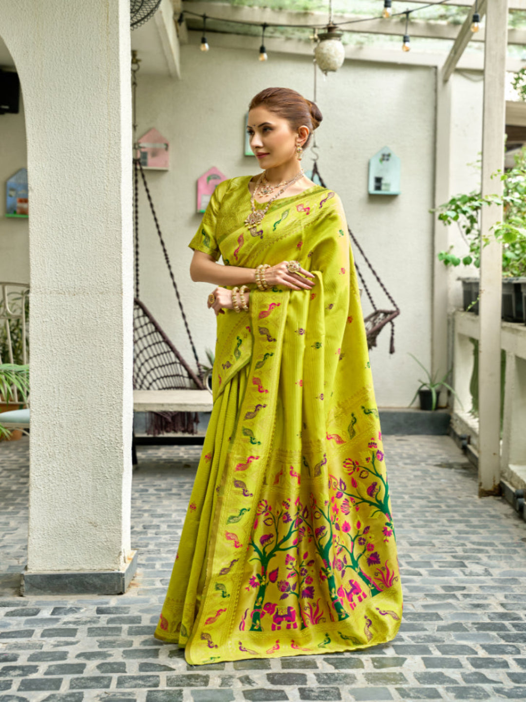 Lime Green Paithani Silk Saree features a standout  symbolizing prosperity and growth.