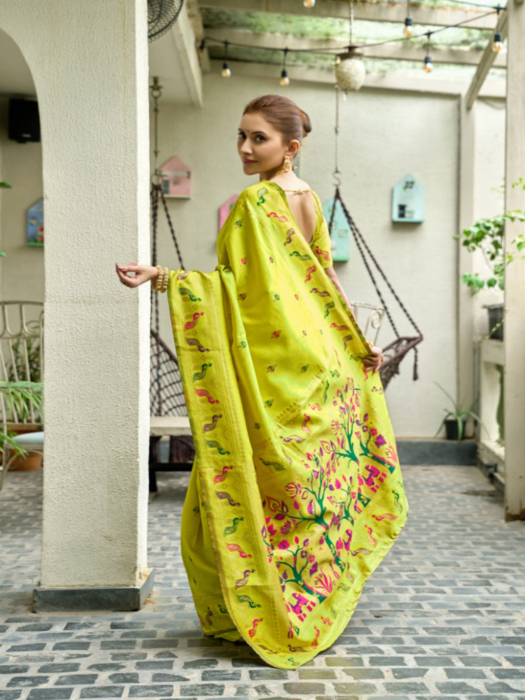 Lime Green Paithani Silk Saree features a standout  symbolizing prosperity and growth.