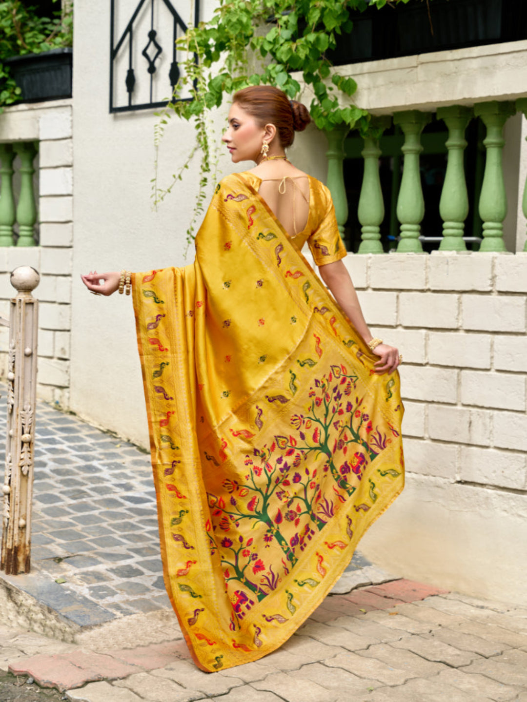 Lime Green Paithani Silk Saree features a standout  symbolizing prosperity and growth.