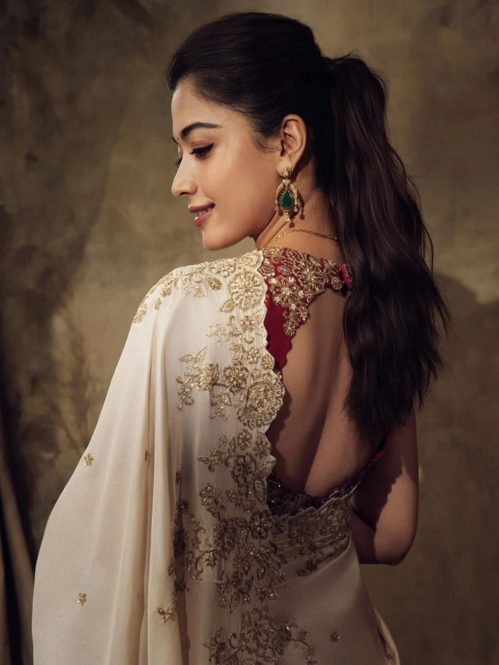 ivory saree crafted from silk with detailed gold Zardosi embroidery