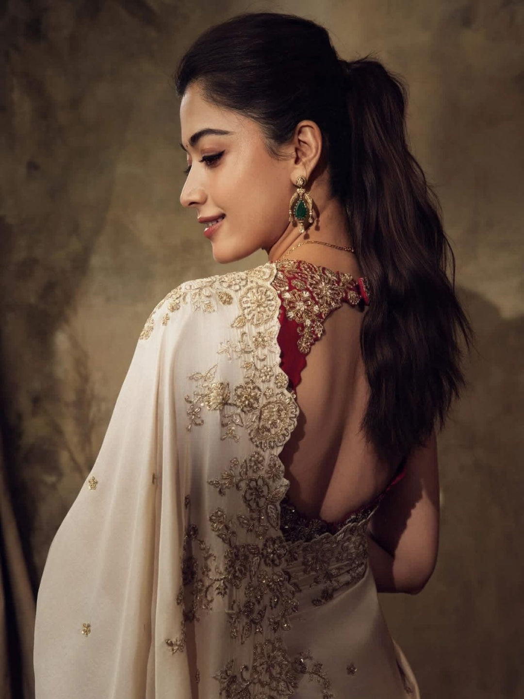 ivory saree crafted from silk with detailed gold Zardosi embroidery