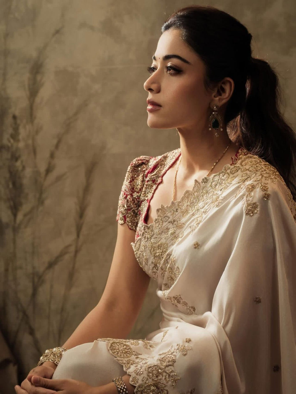 ivory saree crafted from silk with detailed gold Zardosi embroidery