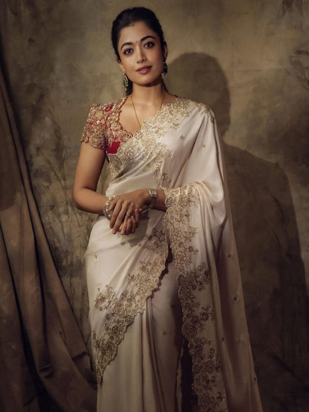 ivory saree crafted from silk with detailed gold Zardosi embroidery