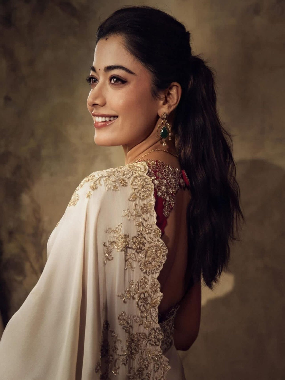 ivory saree crafted from silk with detailed gold Zardosi embroidery