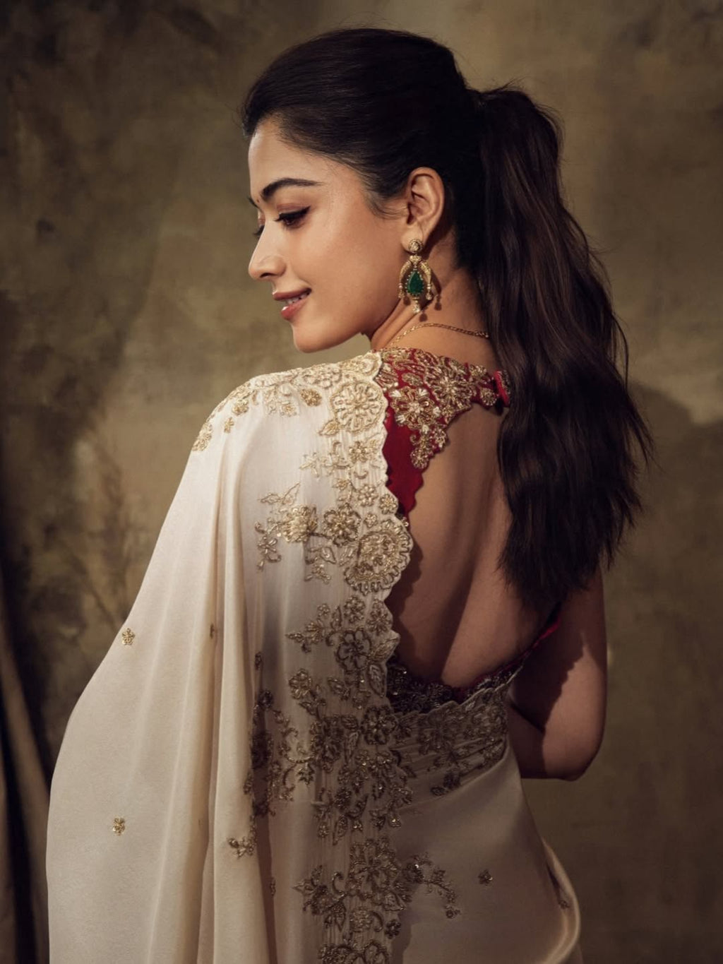 ivory saree crafted from silk with detailed gold Zardosi embroidery