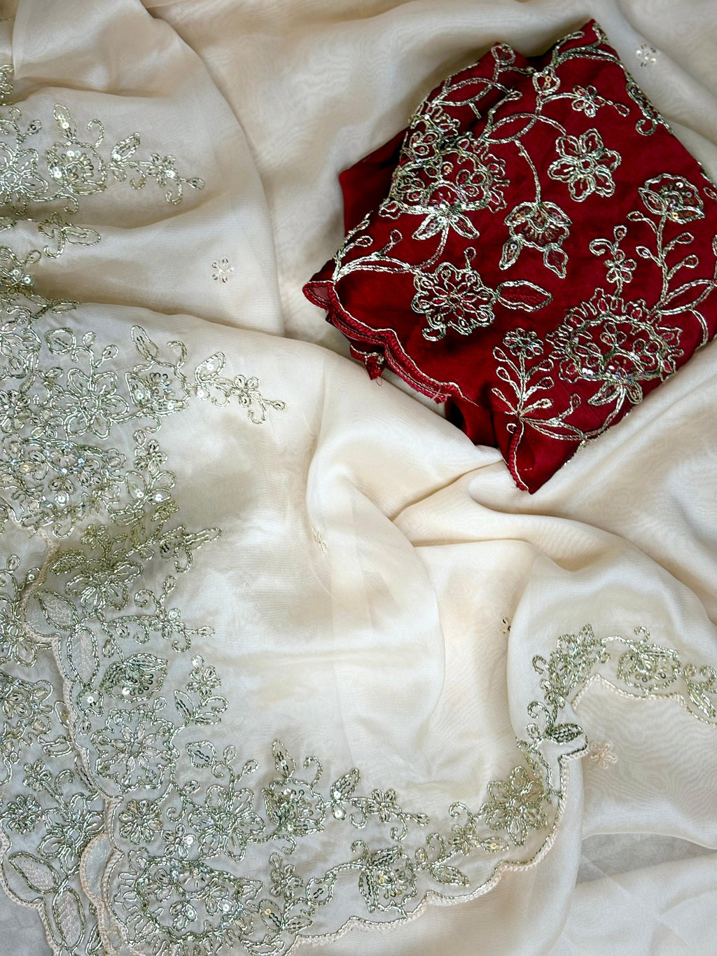 ivory saree crafted from silk with detailed gold Zardosi embroidery