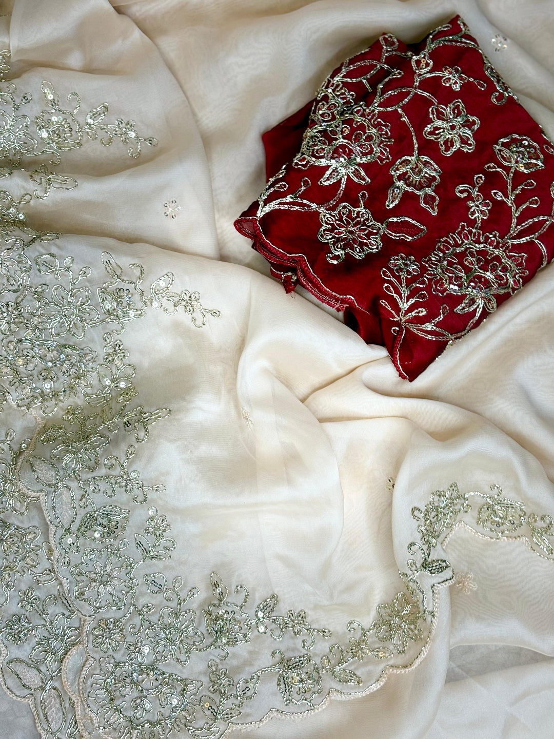 ivory saree crafted from silk with detailed gold Zardosi embroidery