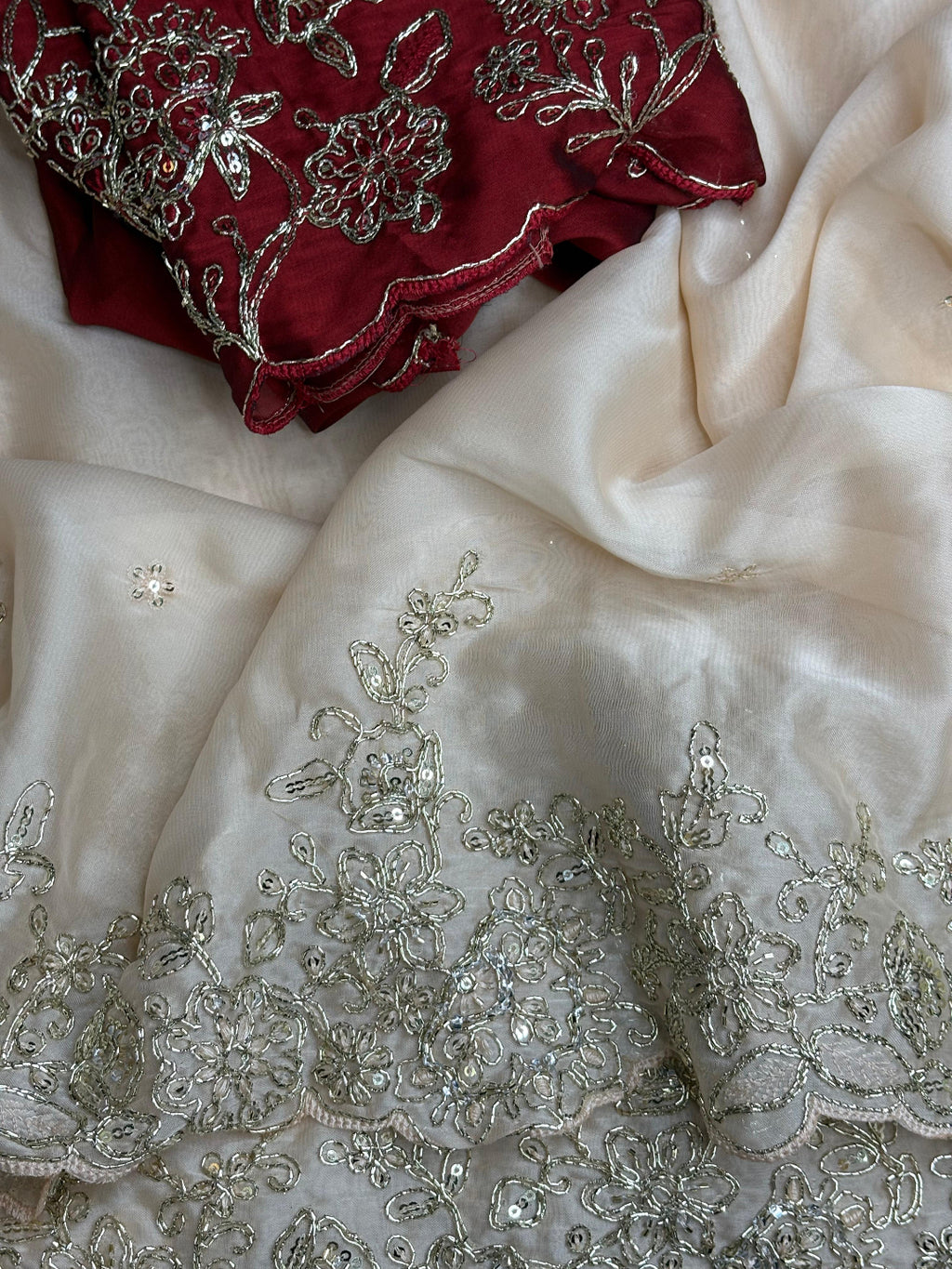 ivory saree crafted from silk with detailed gold Zardosi embroidery