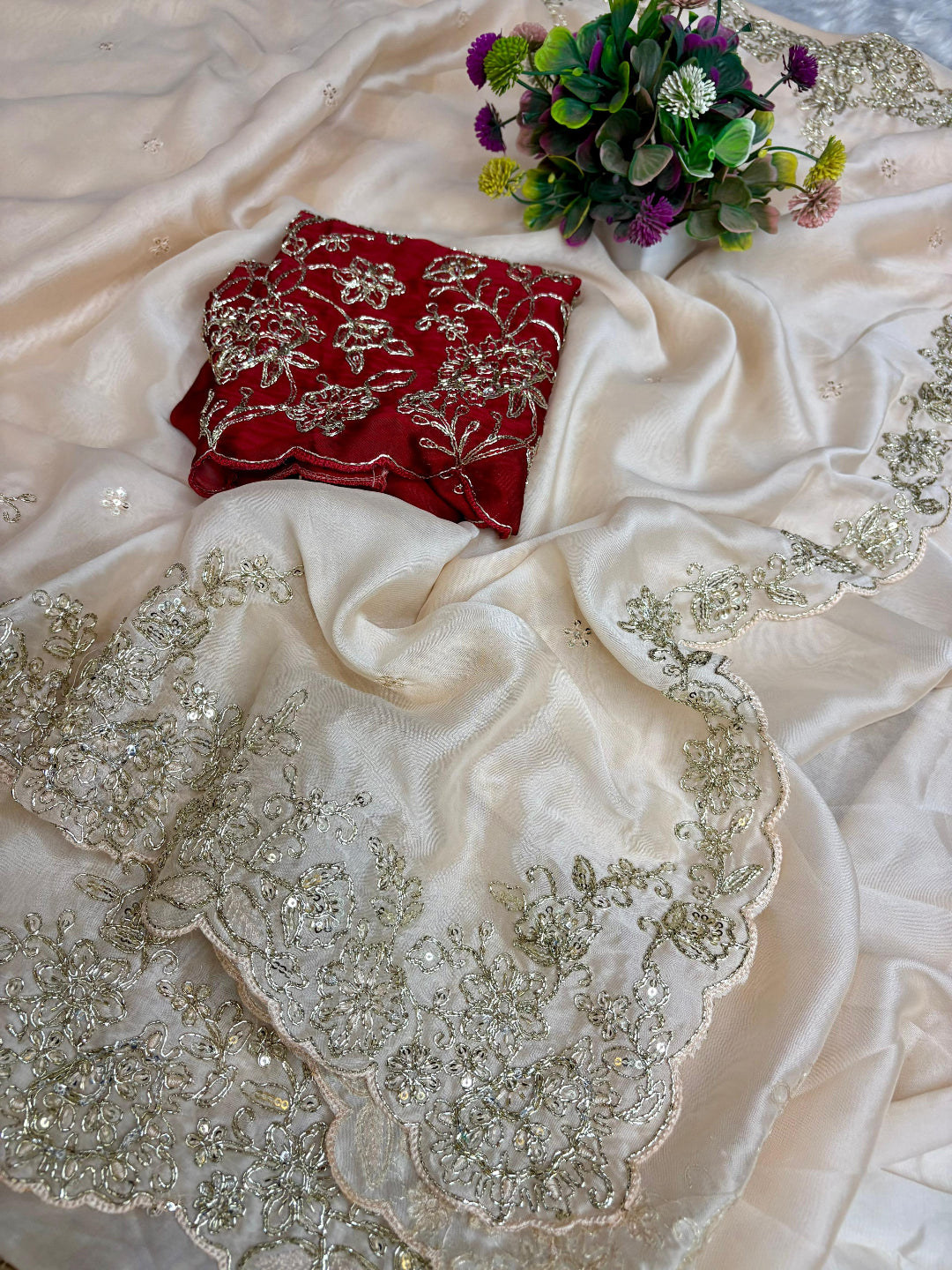 ivory saree crafted from silk with detailed gold Zardosi embroidery