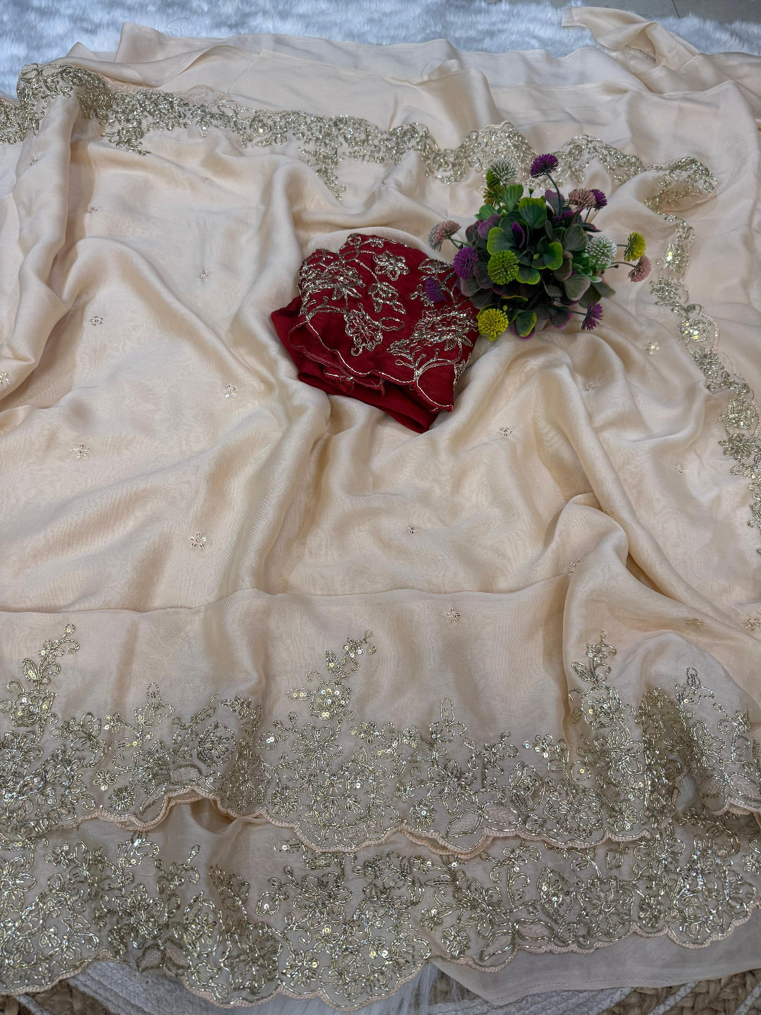 ivory saree crafted from silk with detailed gold Zardosi embroidery