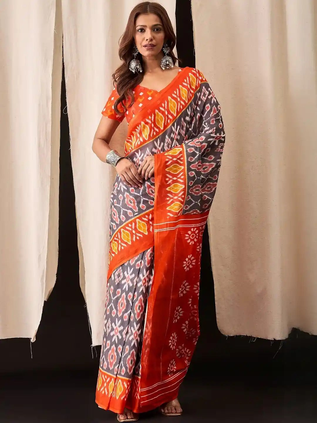 Pochampally Ikat Handloom Saree in Vibrant Orange and Blue.