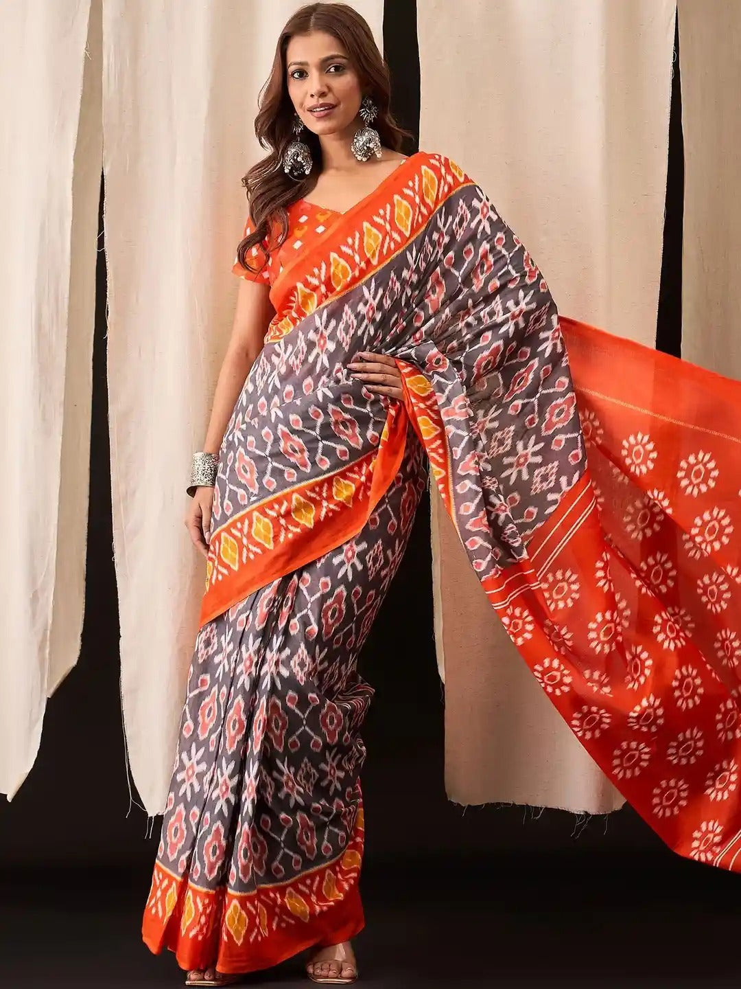 Pochampally Ikat Handloom Saree in Vibrant Orange and Blue.