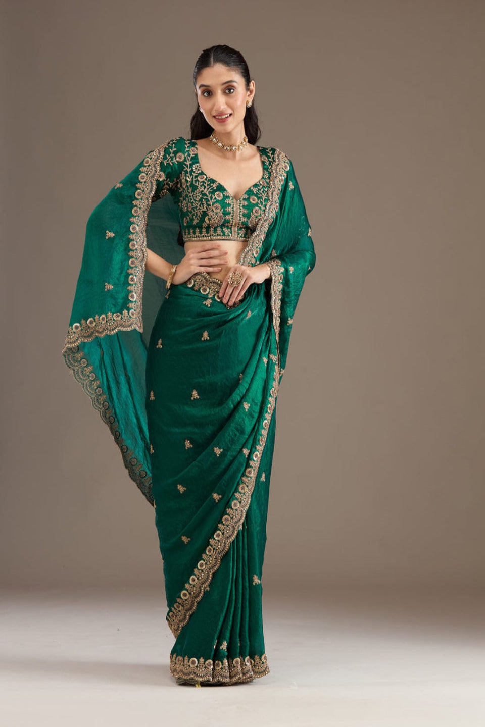 Elegant Emerald Green Embroidered Saree with Heavy Golden Designer Border – Wedding & Festive Wear