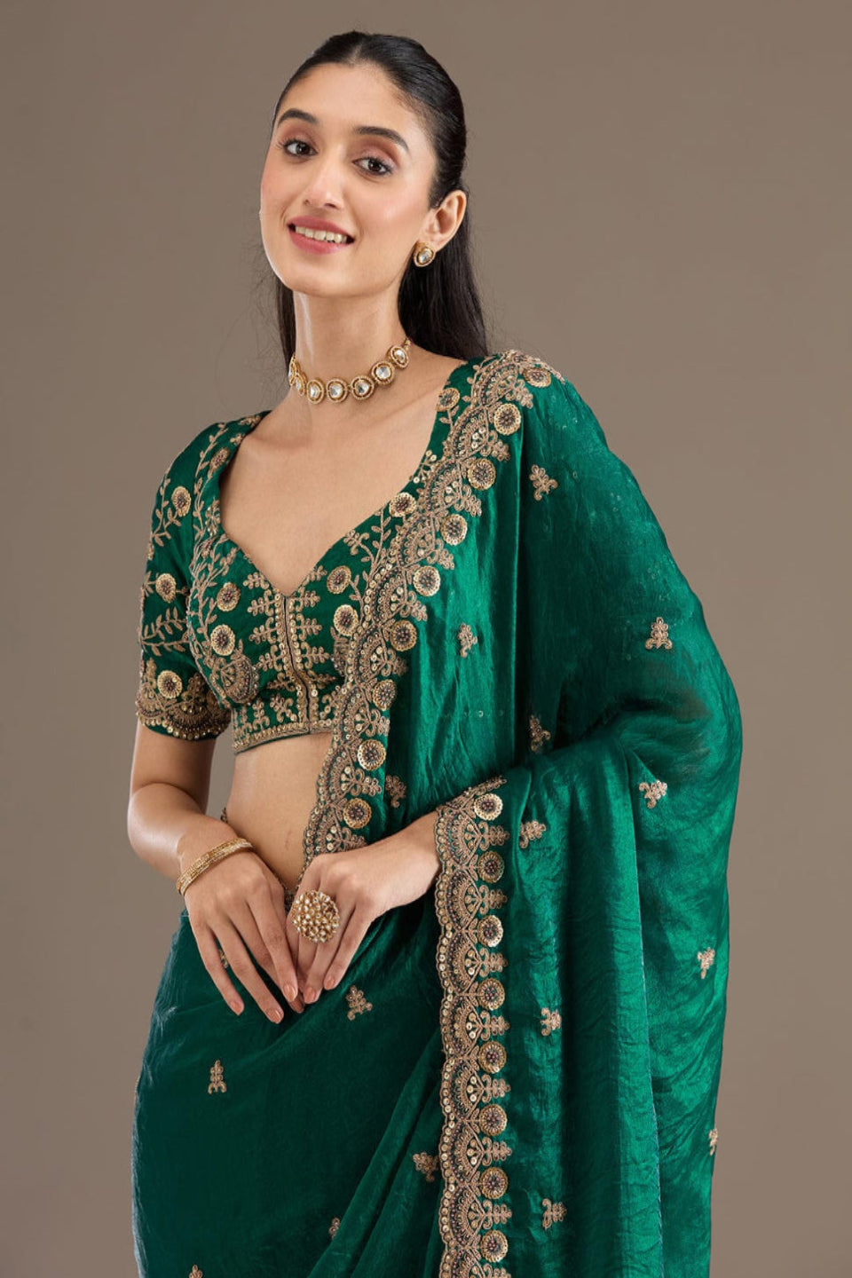 Elegant Emerald Green Embroidered Saree with Heavy Golden Designer Border – Wedding & Festive Wear