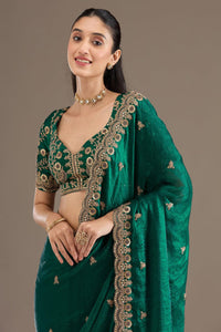 Elegant Emerald Green Embroidered Saree with Heavy Golden Designer Border – Wedding & Festive Wear