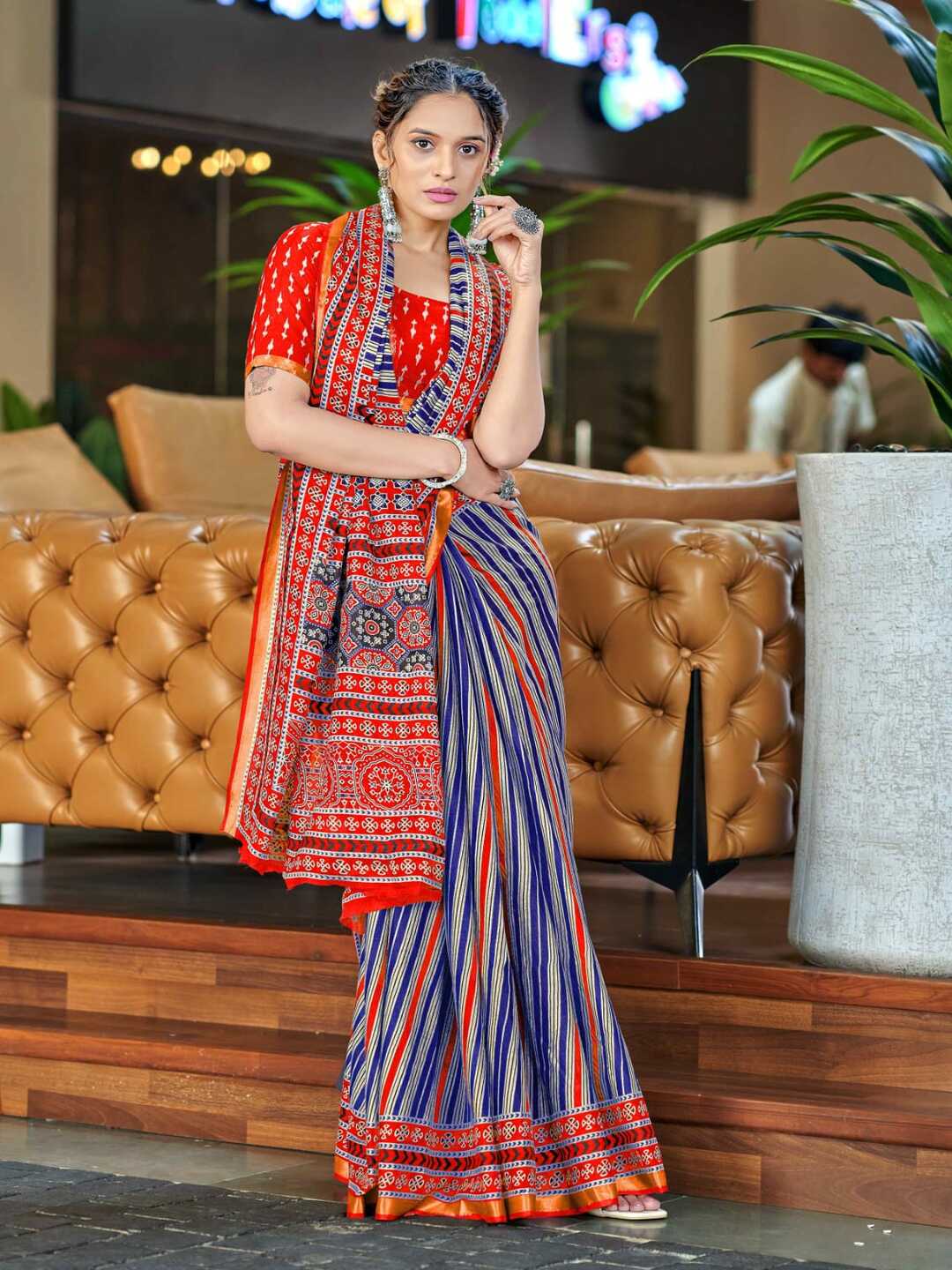 Vibrant Orange Printed Pure Cotton Saree with Traditional Patterns