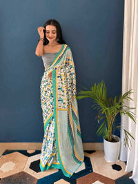 Pure Cotton Off White Saree with Multicolor Abstract Prints & Green Border