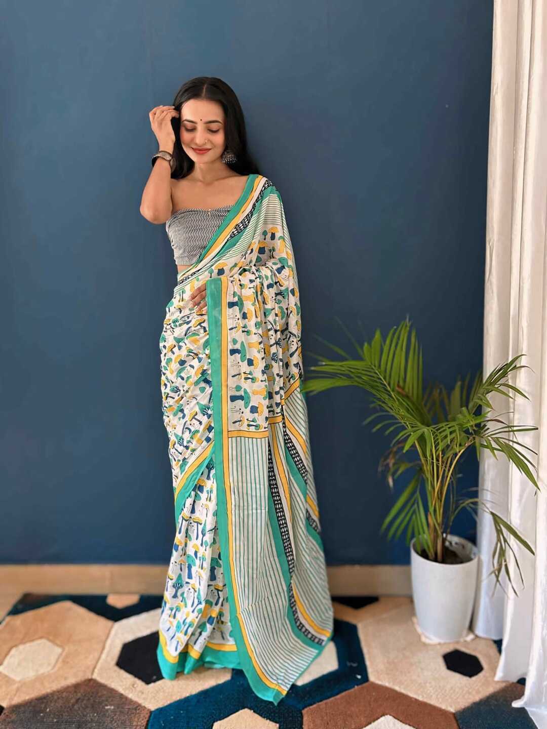 Pure Cotton Off White Saree with Multicolor Abstract Prints & Green Border
