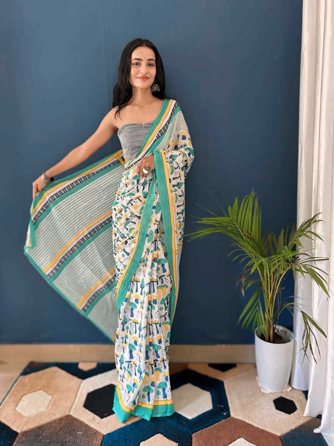 Pure Cotton Off White Saree with Multicolor Abstract Prints & Green Border