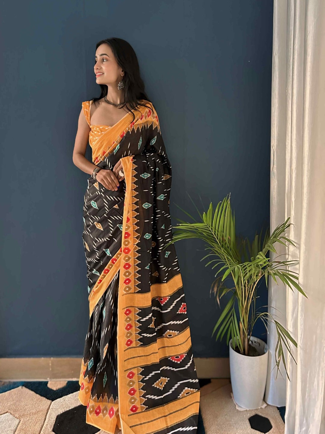 Pure Cotton Black Saree with Orange Border & Ikat Inspired Prints
