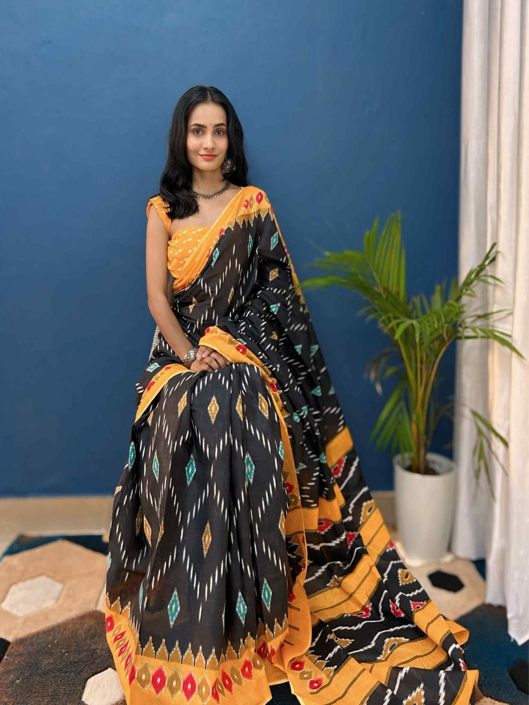 Pure Cotton Black Saree with Orange Border & Ikat Inspired Prints