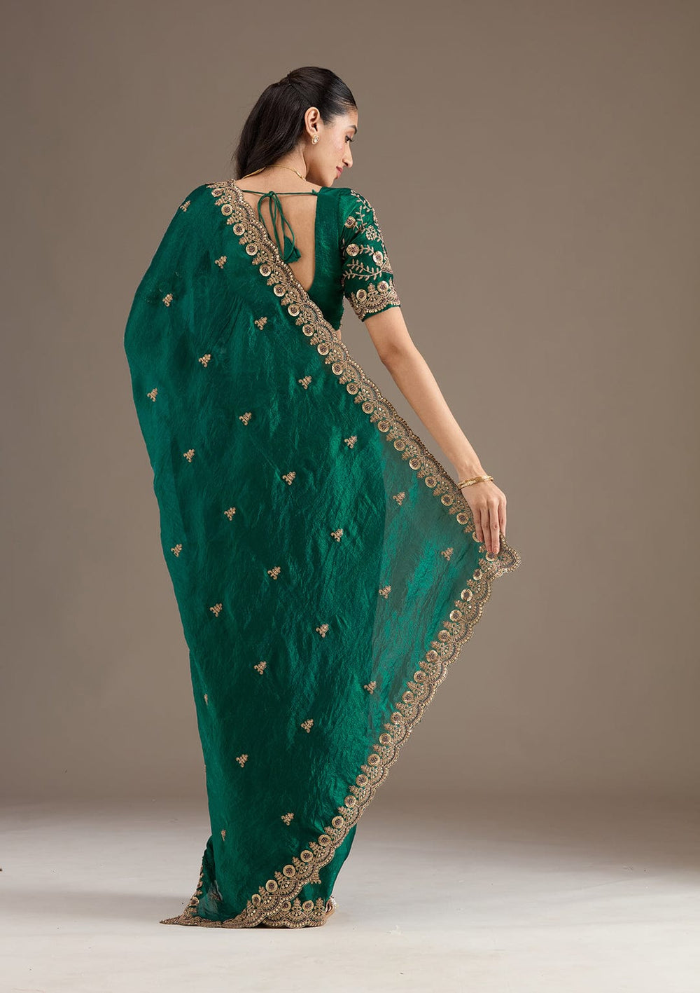Elegant Emerald Green Embroidered Saree with Heavy Golden Designer Border – Wedding & Festive Wear