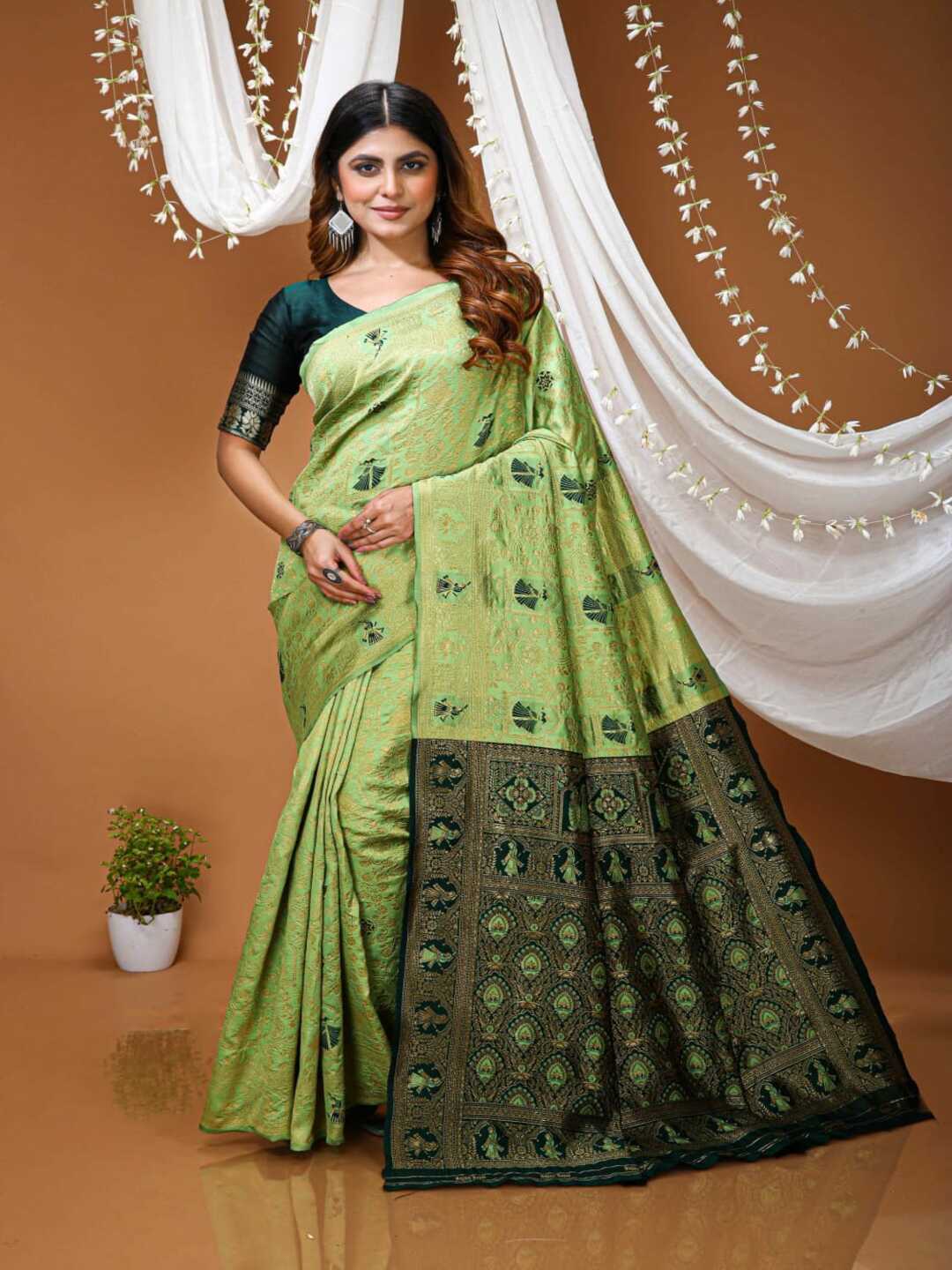 Graceful Pastel Green Banarasi Silk Saree with Rich Zari Border