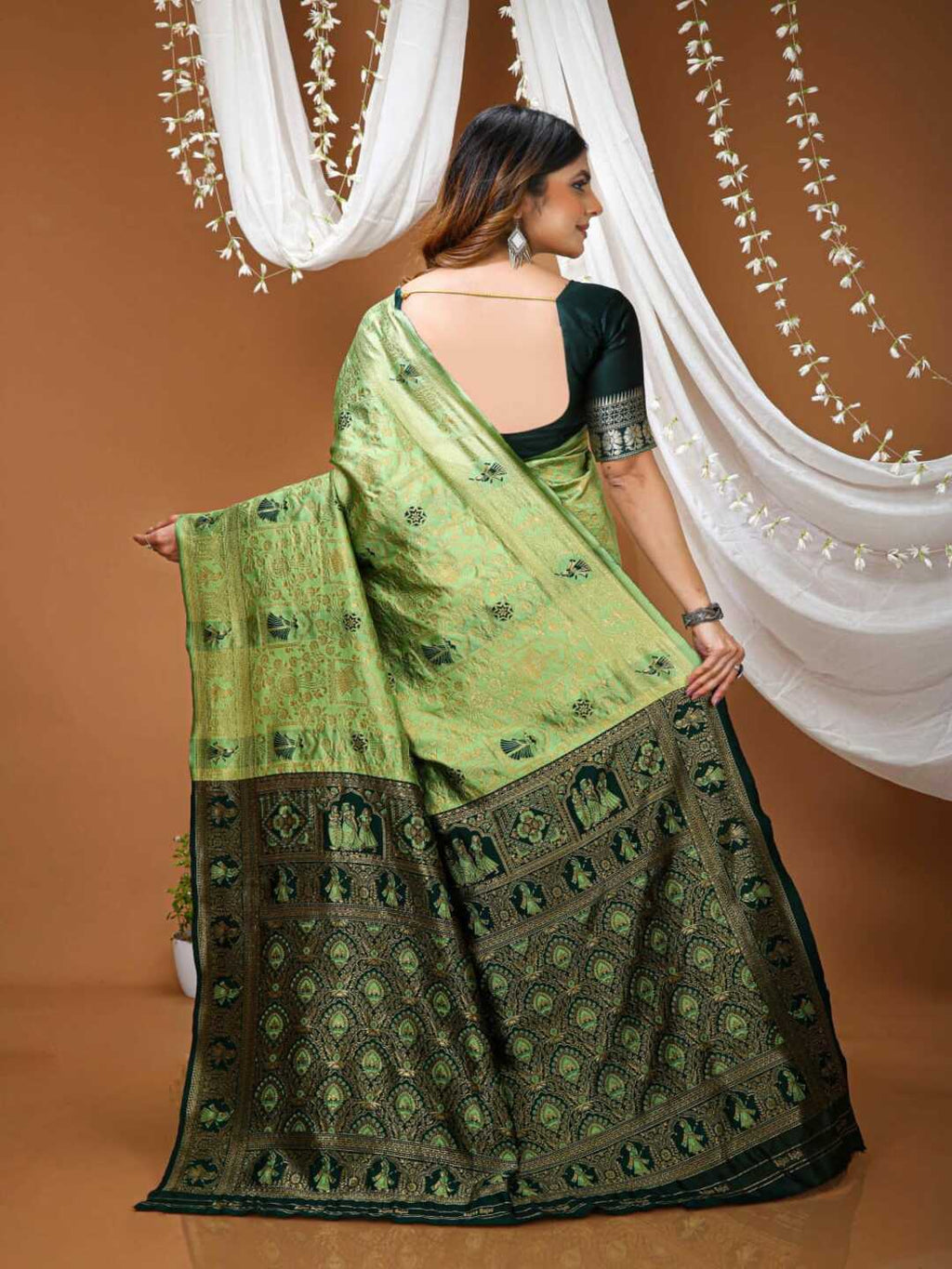 Graceful Pastel Green Banarasi Silk Saree with Rich Zari Border